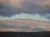 Top of Mauna Kea and the observatories are in view.