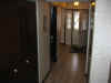 Entry hall - powder room and utility room on left, washer/dryer under stairs